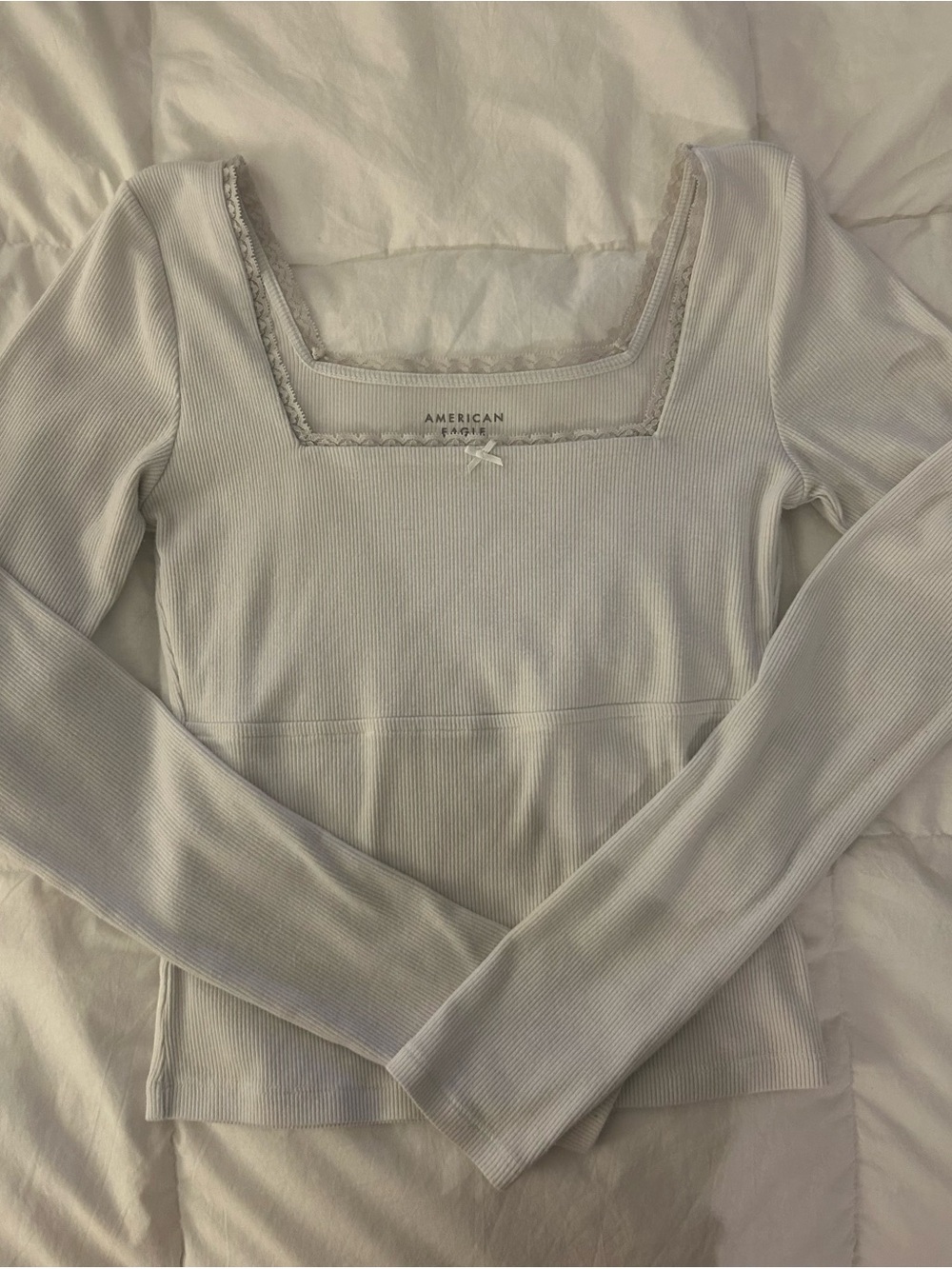 white coquette babydoll style longsleeve top